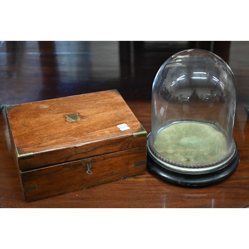 487 - A Victorian brass-bound walnut writing slope, 30 cm wide to/w a glass dome on ebonised plinth (2)