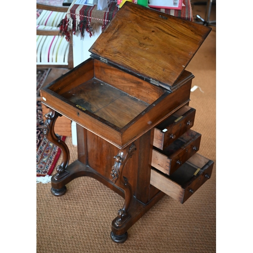 290 - A Victorian rosewood davenport desk, the sloped hinged top inset with brown leather, four side drawe... 