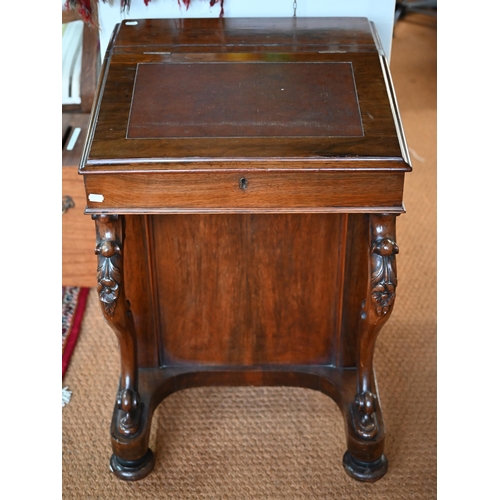 290 - A Victorian rosewood davenport desk, the sloped hinged top inset with brown leather, four side drawe... 