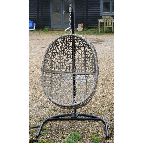 70 - A 'Majestique' woven synthetic rattan hanging garden 'egg' chair on suspension chain from black tubu... 