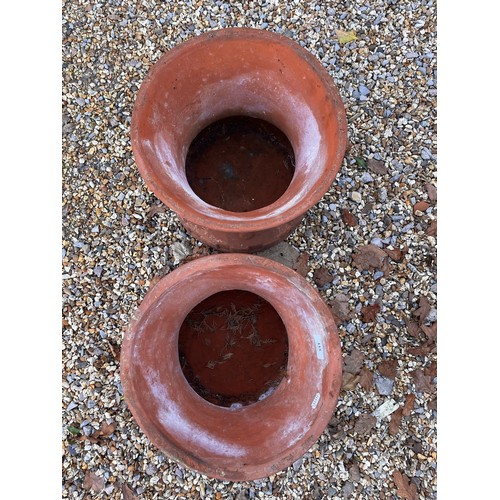 115 - A pair of weathered terracotta planter pots/plinths (2)