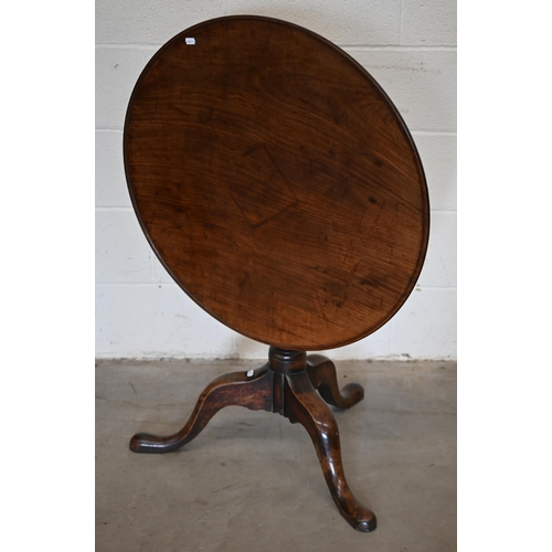 247A - A 19th century mahogany circular tilt-top table on turned column and triform supports, 80 cm diamete... 