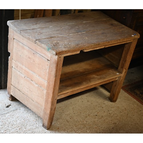 37 - A rustic pitch pine French side table with tapered left hand side and open fronted under-tier, 104 c... 