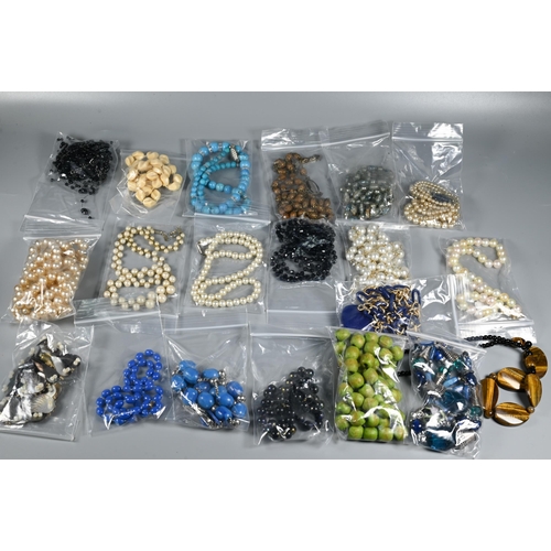 267 - A large collection of bead necklaces including pearls, tiger's eye, glass etc