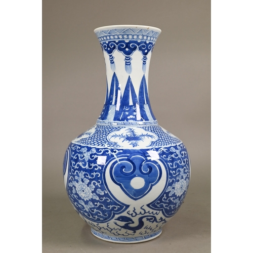 334 - A late 19th century Chinese blue and white vase, the flared neck painted with diaper, ruyi-head and ... 