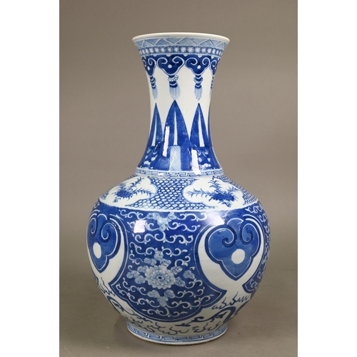 334 - A late 19th century Chinese blue and white vase, the flared neck painted with diaper, ruyi-head and ... 