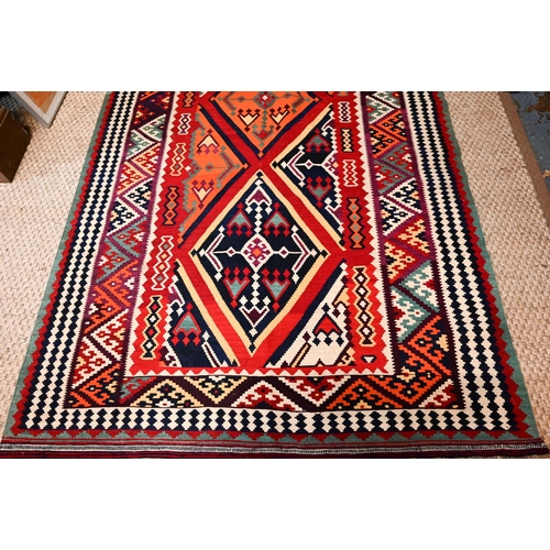 829 - A contemporary South West Persian Qashqai Kelim with repeating stylized lozenges in multi-colours, 2... 