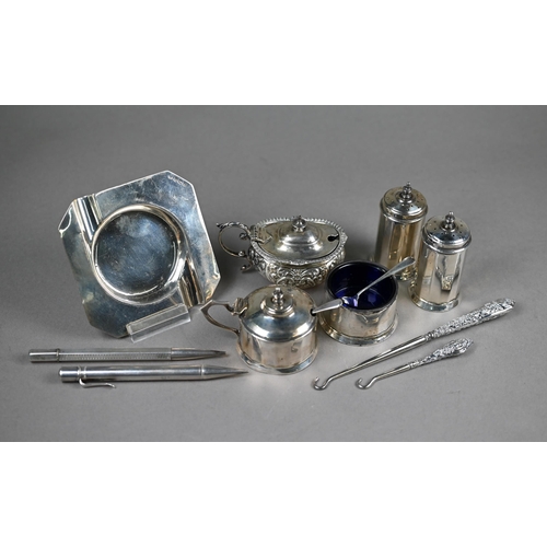 102 - A silver four-piece condiment set, William Neale, Birmingham 1937, to/w an Edwardian mustard and an ... 