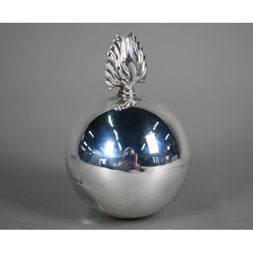 106 - A silver cigar table-lighter in the form of a traditional globular grenade with flambeau finial, Wil... 