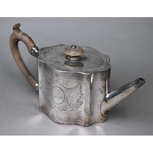 117 - A George III silver teapot of serpentine form with engraved decoration and wooden handle and finial,... 