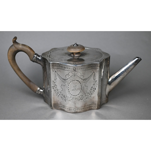 117 - A George III silver teapot of serpentine form with engraved decoration and wooden handle and finial,... 