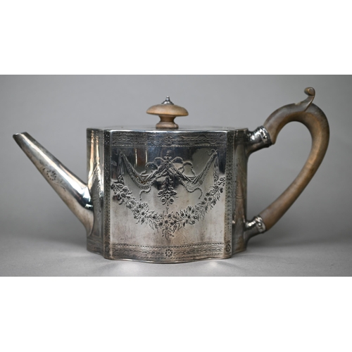 117 - A George III silver teapot of serpentine form with engraved decoration and wooden handle and finial,... 