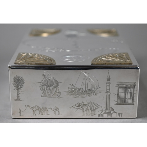 120 - A modern silver State of Qatar presentation cigarette box, engraved with map of Qatar, depictions of... 