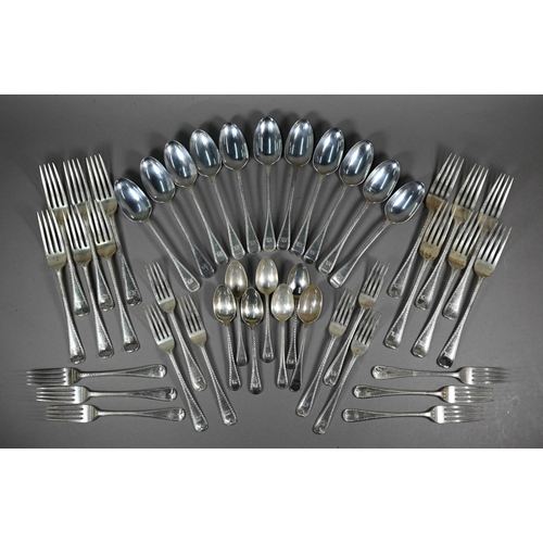 121 - A matched set of mostly Victorian silver bright-cut flatware, comprising twelve each table and desse... 