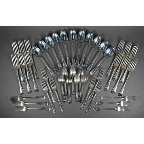 121 - A matched set of mostly Victorian silver bright-cut flatware, comprising twelve each table and desse... 