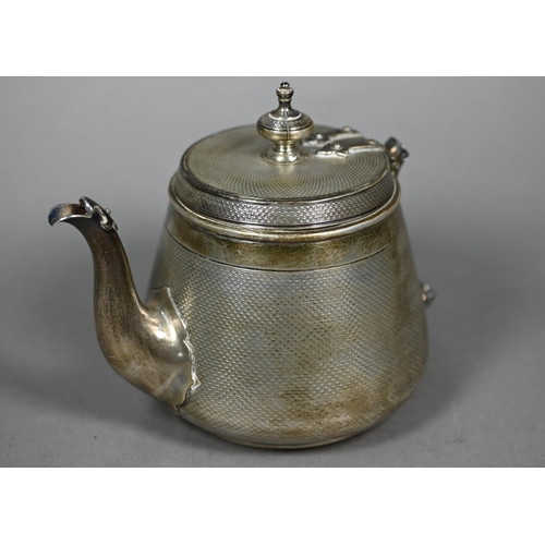 124 - A Victorian silver bachelor teapot, decorated overall with engine turning, with rivetted strap hinge... 