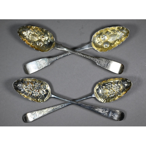 128 - Two pairs of silver berry spoons of Georgian origin, with embossed and gilded bowls, 7.2oz