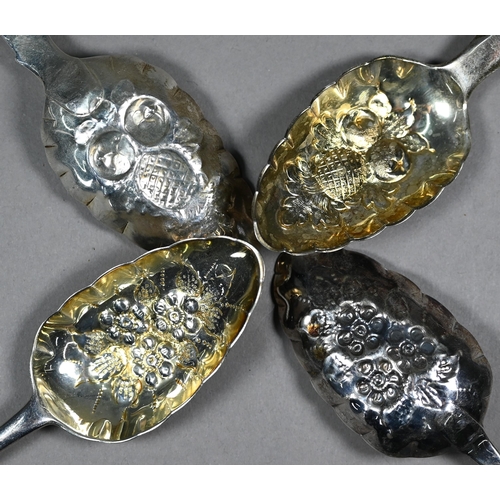 128 - Two pairs of silver berry spoons of Georgian origin, with embossed and gilded bowls, 7.2oz