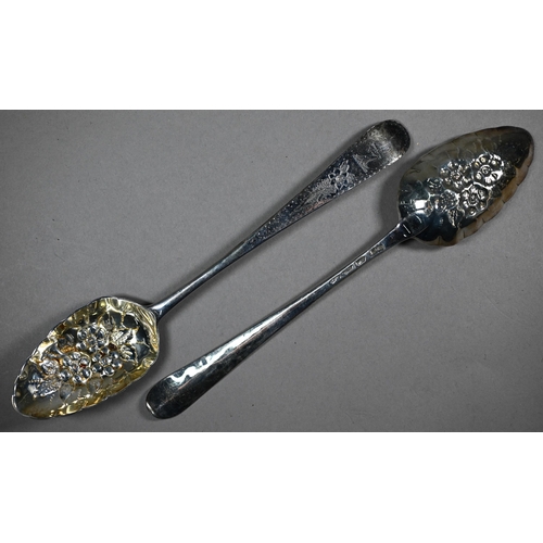 128 - Two pairs of silver berry spoons of Georgian origin, with embossed and gilded bowls, 7.2oz