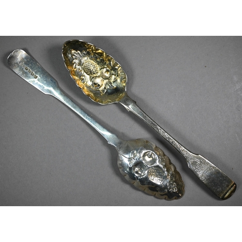 128 - Two pairs of silver berry spoons of Georgian origin, with embossed and gilded bowls, 7.2oz