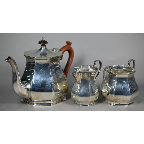 135 - A silver three-piece tea service of octagonal form, the teapot with composite handle and finial, Ale... 