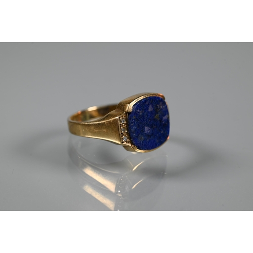 219 - A 9ct yellow gold signet ring set with plain rectangular lapis lazuli plaque with diamond set should... 