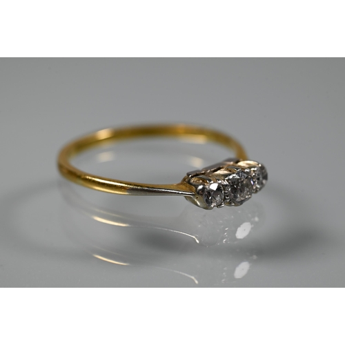 221 - A three-stone diamond ring set 18ct yellow gold, size Q