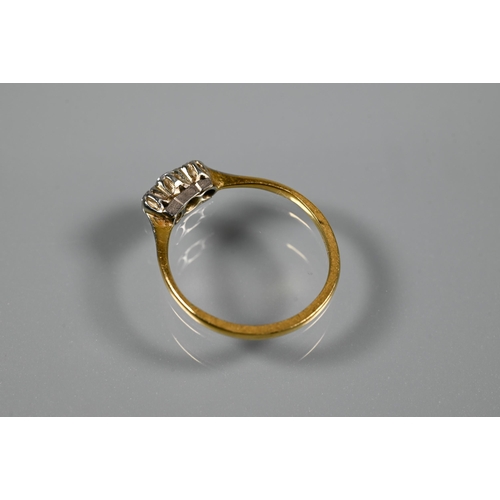 221 - A three-stone diamond ring set 18ct yellow gold, size Q