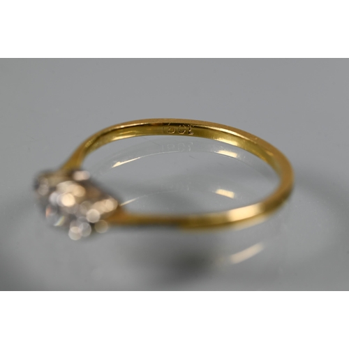 221 - A three-stone diamond ring set 18ct yellow gold, size Q