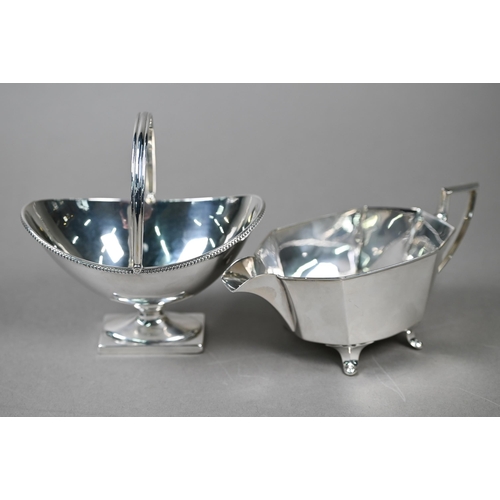 23 - A late Victorian silver Adam Revival bonbon basket of navette form with swing loop handle, with bead... 