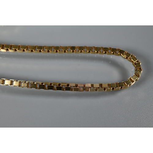 231 - A long yellow metal box link chain stamped 9k 375, 62 cm long, approx 50gPossibly originally two cha... 