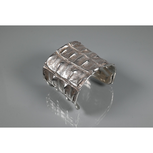 235 - Patrick Mavros - A silver 'Croc Hornback' cuff, size small (approx 5.5cm diam on largest edge), insc... 