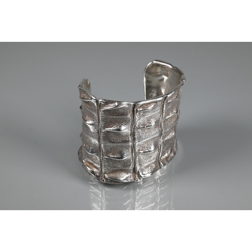 235 - Patrick Mavros - A silver 'Croc Hornback' cuff, size small (approx 5.5cm diam on largest edge), insc... 