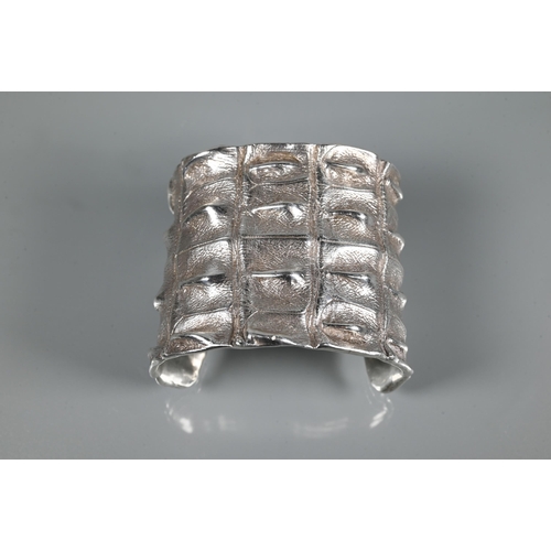 235 - Patrick Mavros - A silver 'Croc Hornback' cuff, size small (approx 5.5cm diam on largest edge), insc... 