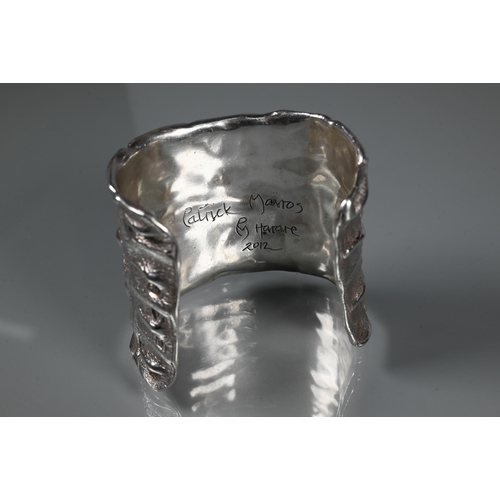 235 - Patrick Mavros - A silver 'Croc Hornback' cuff, size small (approx 5.5cm diam on largest edge), insc... 