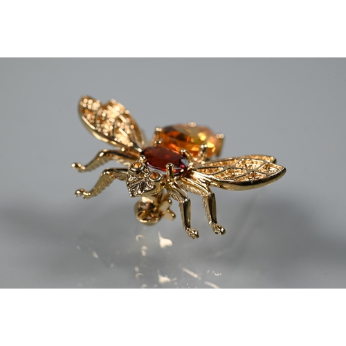 244 - A 9ct yellow gold bug brooch with outswept wings and stone set body, 3cm, approx 3.4g all in to/w a ... 