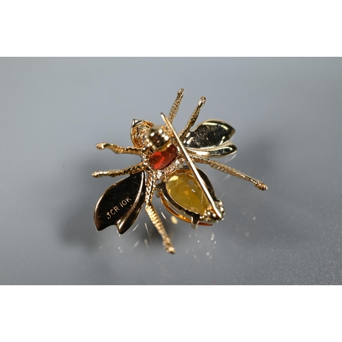 244 - A 9ct yellow gold bug brooch with outswept wings and stone set body, 3cm, approx 3.4g all in to/w a ... 