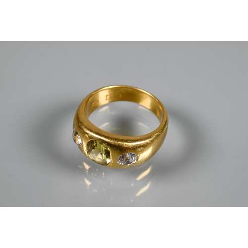 251 - A 22ct yellow gold gypsy ring set with two diamonds and central yellow stone, possibly sapphire, dia... 