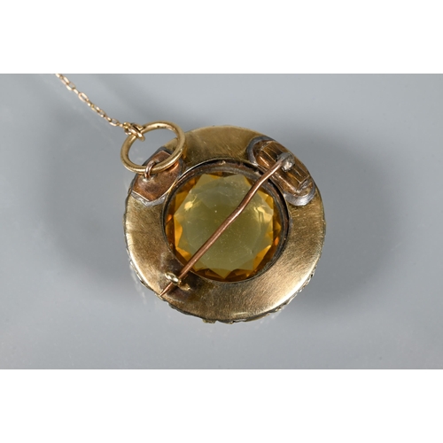 254 - A Victorian roundel brooch with circular citrine to centre with carved border around, 3cm diam ... 