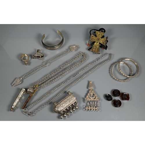 276 - A collection of white metal Omani jewellery including bangles, chains, pendants, glass-set Coptic cr... 