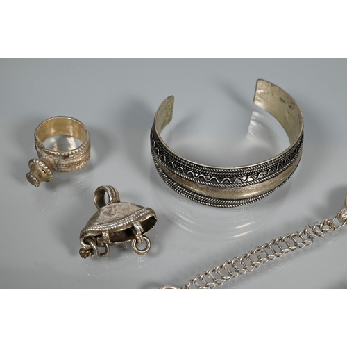 276 - A collection of white metal Omani jewellery including bangles, chains, pendants, glass-set Coptic cr... 