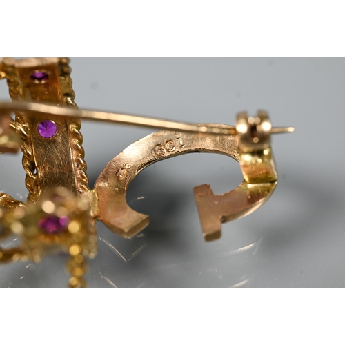 280 - A 1960s yellow metal brooch in form of a crown above the initial 'G', the crown set with rubies and ... 