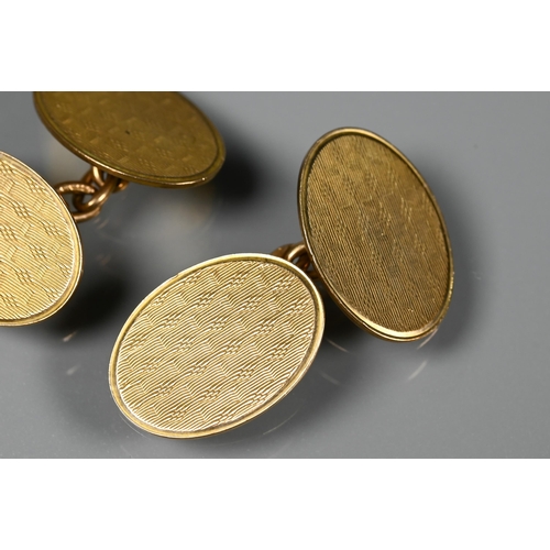 289 - A pair of oval 9ct yellow god chain linked cufflinks with engine turned decoration, approx 8.8g