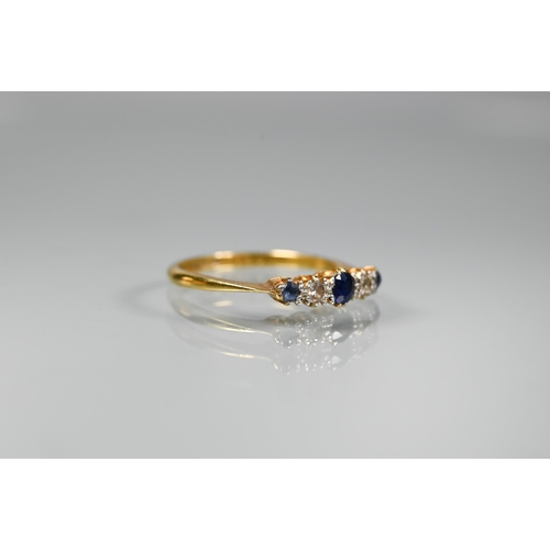 294 - An 18ct yellow gold ring set with five graduated alternate sapphires and diamonds in claw setting, s... 