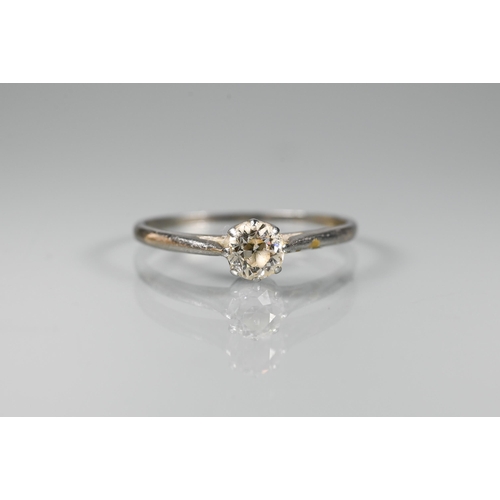 295 - A single stone diamond ring set unmarked white metal, size P, approx 0.35 carats