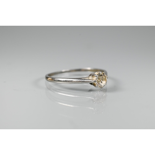 295 - A single stone diamond ring set unmarked white metal, size P, approx 0.35 carats