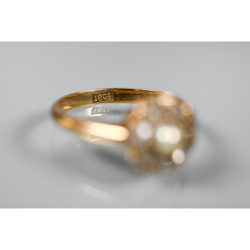 296 - An antique diamond and pearl set cluster ring, the seven old cut diamonds around a central half pear... 