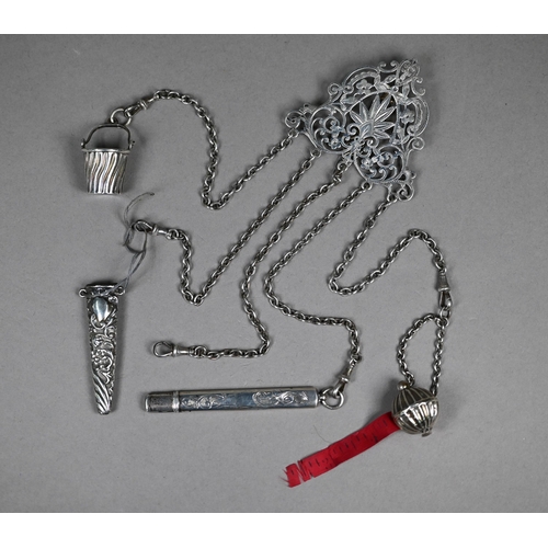 302 - A late Victorian engraved and pierced silver chatelaine with five chains with dog-clips, Lawrence Em... 