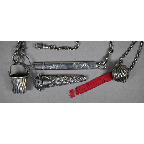 302 - A late Victorian engraved and pierced silver chatelaine with five chains with dog-clips, Lawrence Em... 