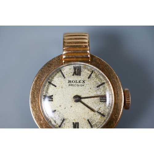 318 - An 18K gold ladies Rolex wristwatch, with 18 jewel movement and champagne dial, 21 mm dia., 12 g all... 